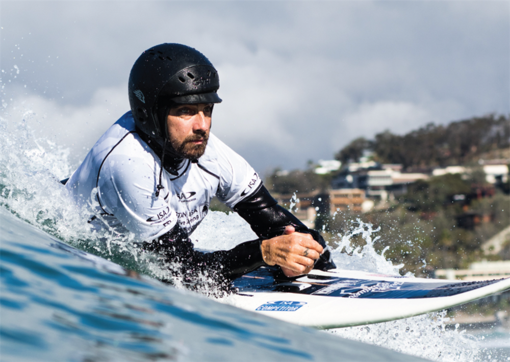 TACO Marine Life Rolls On Jesse Billauer on surfboard.